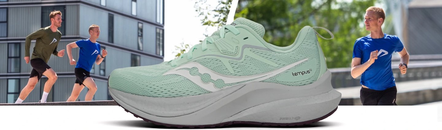 Saucony Tempus 2 running shoe in mint green with white midsole, shown alongside male runners training outdoors