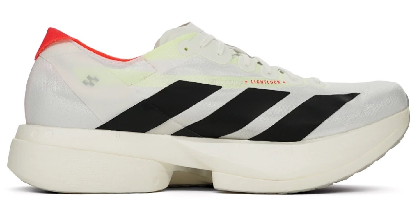 Adidas Adizero Adios Pro 4 in white and black with red heel accent, inner side view, on white background