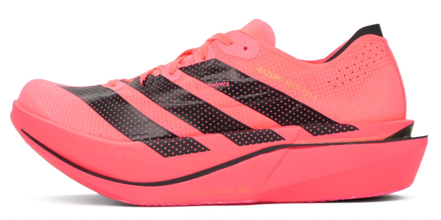 Adidas Adizero Adios Pro 5 racing shoe in coral pink with black Three Stripes and Lightstrike Pro midsole, lateral view