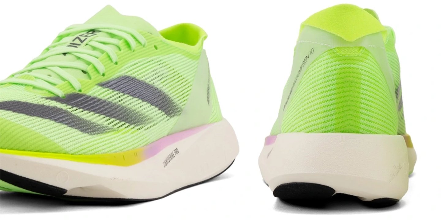 Adidas Takumi Sen 10 running shoe in neon green, shown from front and rear angles highlighting knit upper and midsole.