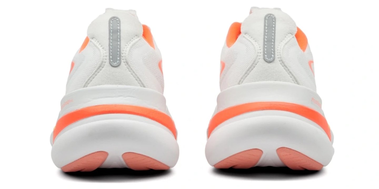 Rear view of two Mizuno Sky Prime running shoes in white with orange midsole stripe and pink outsole pods