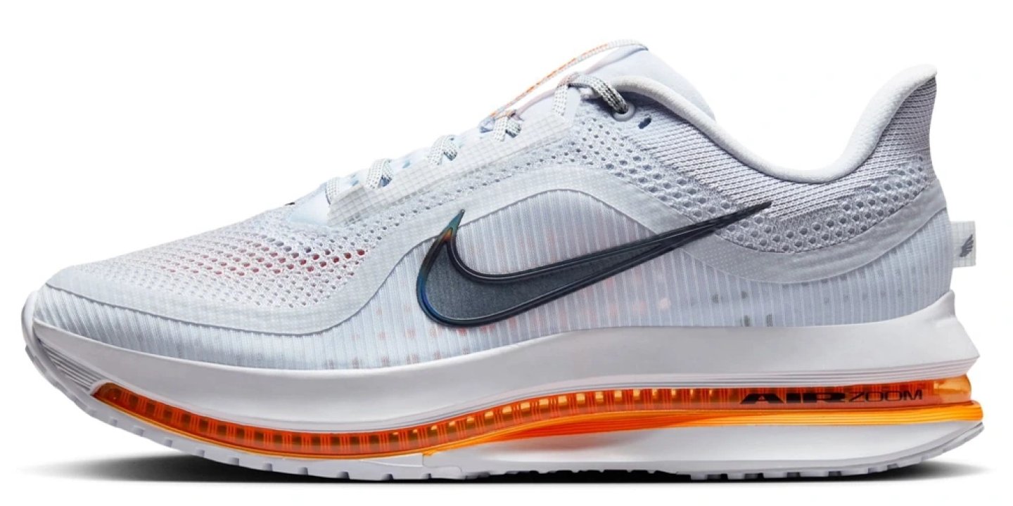 Nike Pegasus Premium running shoe in white with an orange Air Zoom midsole unit and dark navy Swoosh logo, lateral view.