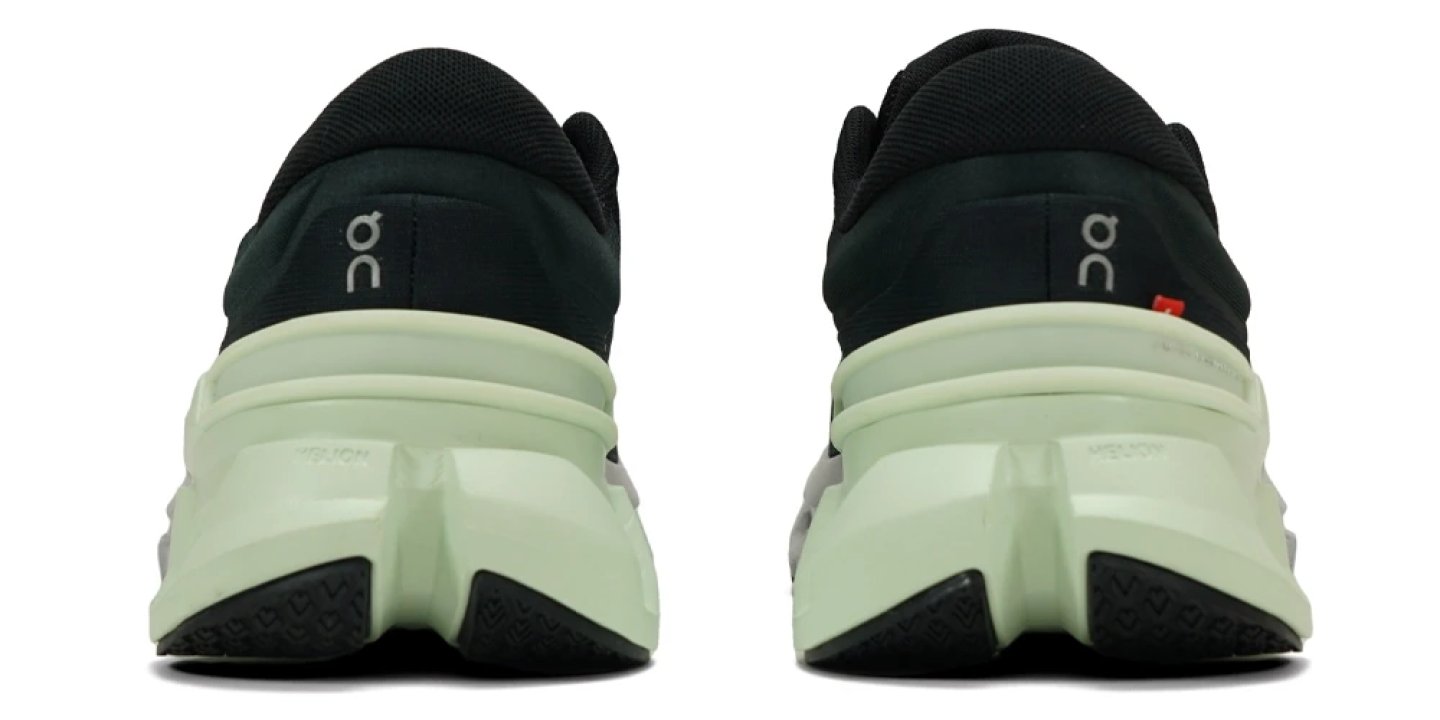 On Cloudflyer 5 running shoes heel view, black upper with light mint Helion foam midsole and rubber outsole