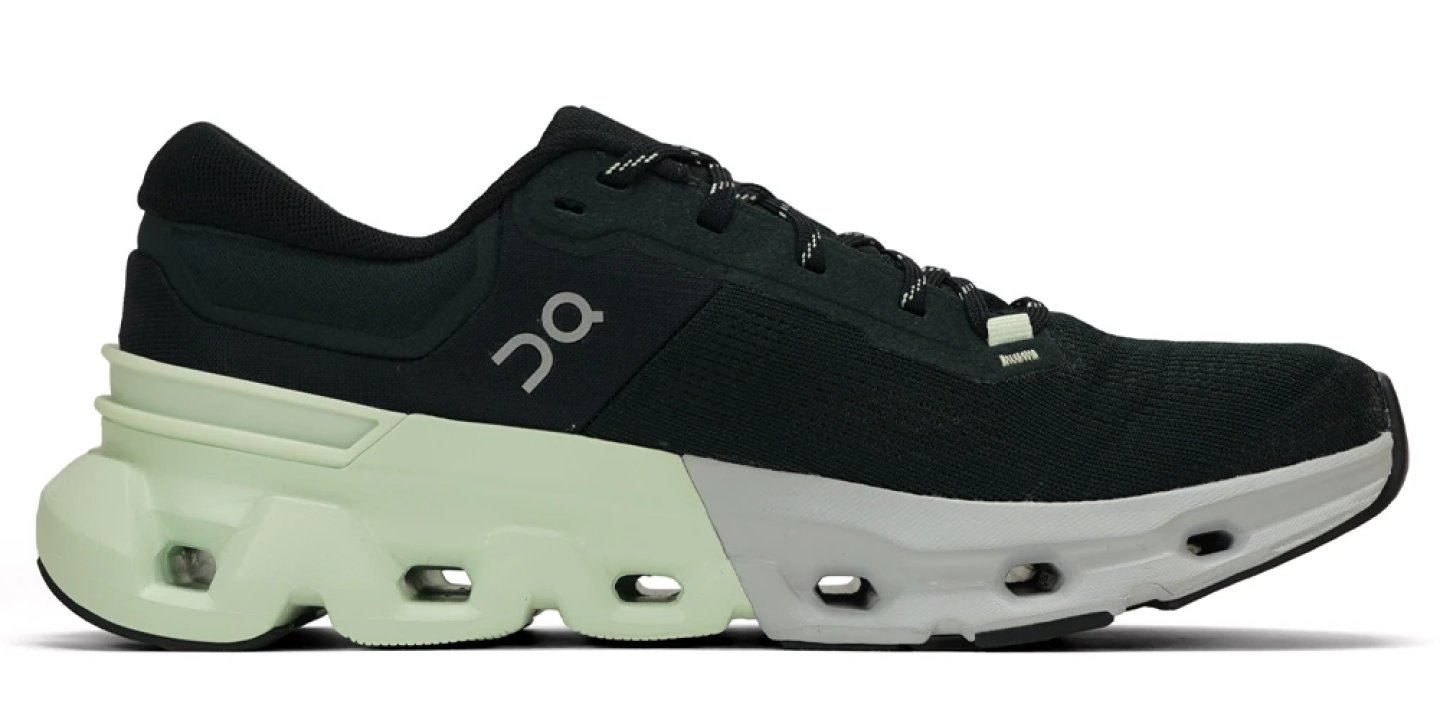 On Cloudflyer 5 running shoe inner side view, black knit upper with mint green CloudTec midsole