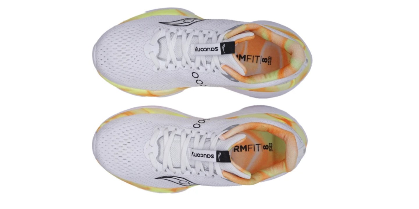 Top view of a pair of Saucony Endorphin Trainer running shoes in white with orange and yellow midsole accents