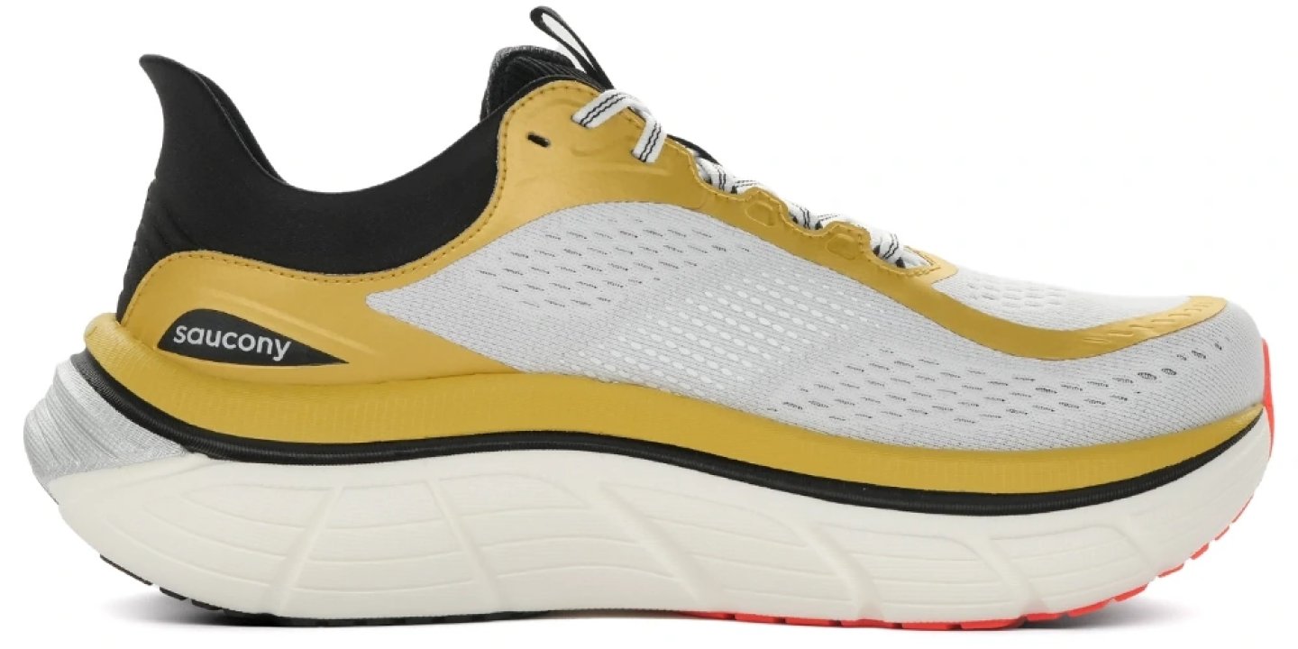 Saucony Paramount Max Foam running shoe in white, gold and black with a thick cushioned midsole, lateral view
