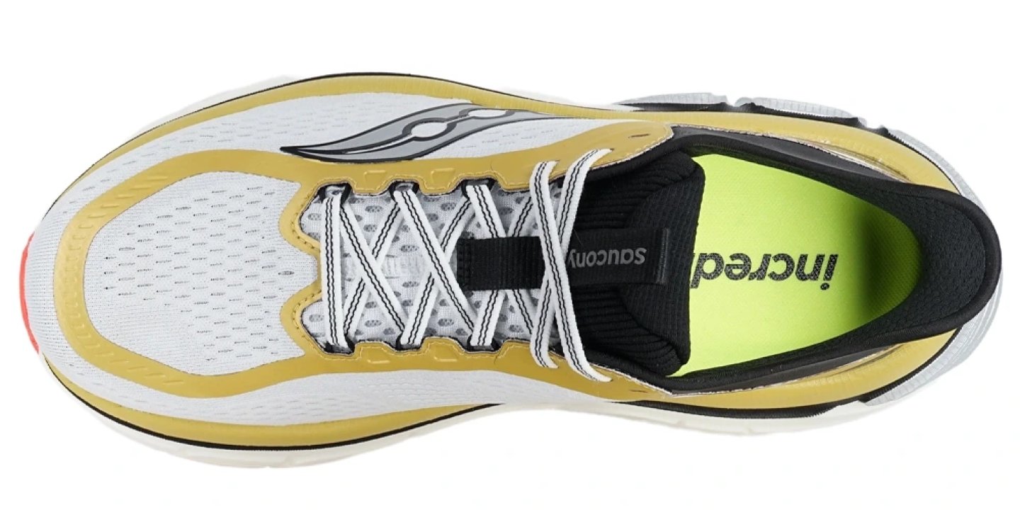 Top view of Saucony Paramount Max running shoe in white, gold and black with neon yellow-green insole