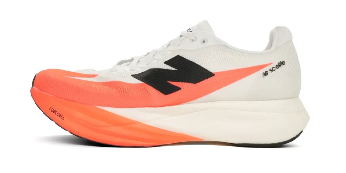 New Balance FuelCell SC Elite racing shoe in white with orange midsole and accent, lateral view on white background.