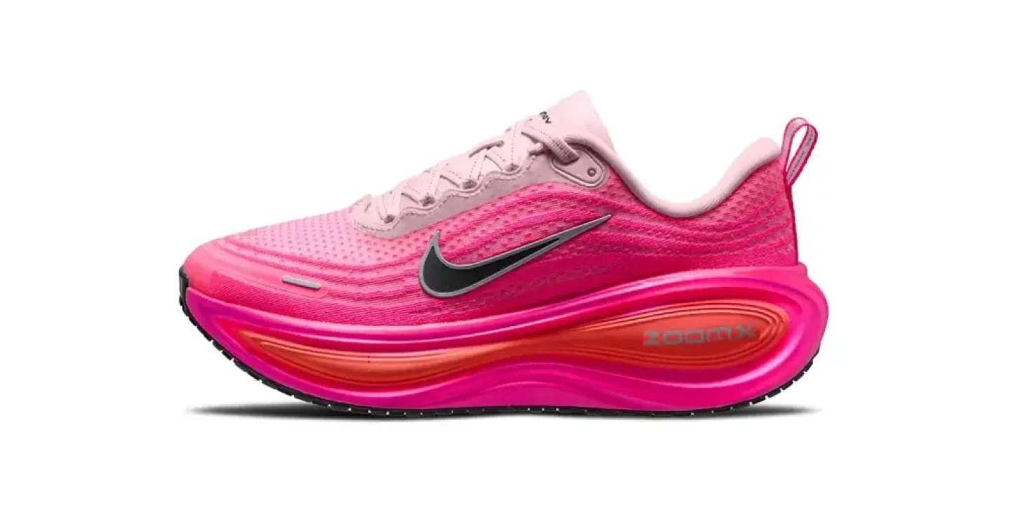 Nike ZoomX women's running shoe in pink gradient colourway with black Swoosh and cushioned foam midsole.