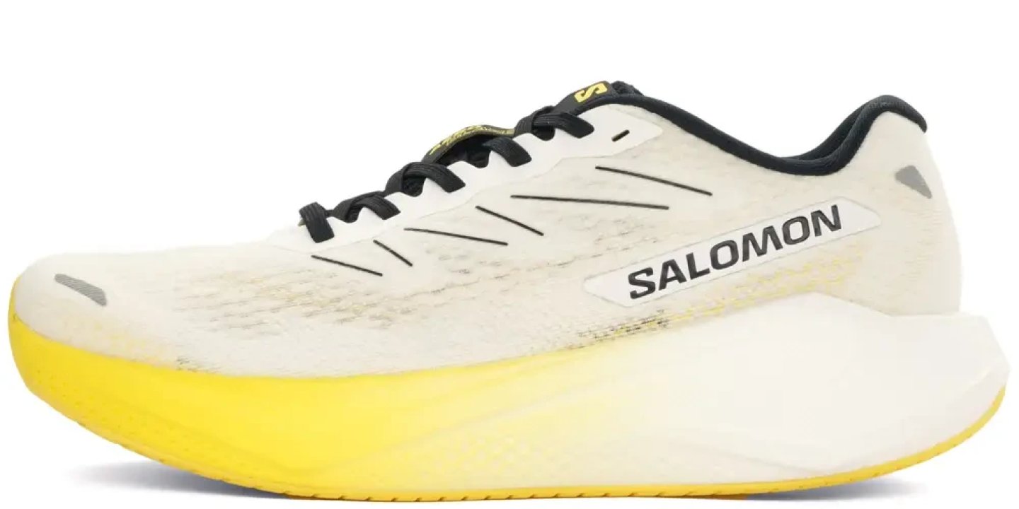 Salomon Spectur road running shoe in white with yellow midsole and black collar, lateral side view