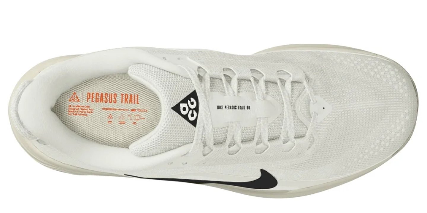 Nike Pegasus Trail 06 trail running shoe in white, viewed from above, showing mesh upper and black Swoosh.