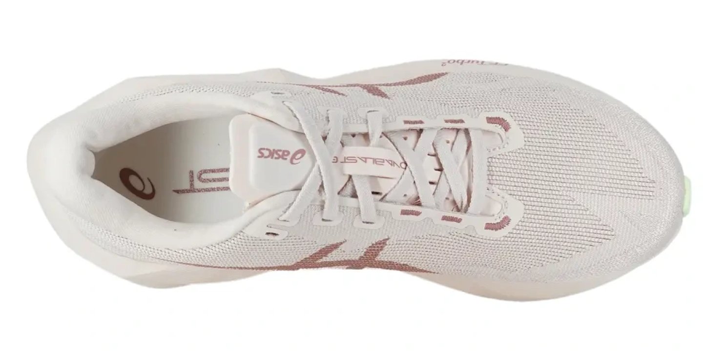Top view of the ASICS Novablast 6 running shoe in cream with rose gold logo detailing and mesh upper