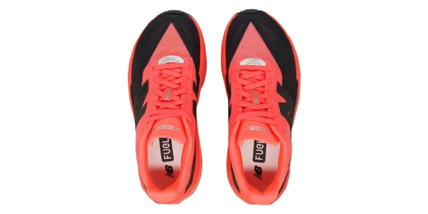 Top view of New Balance FuelCell RC Elite running shoes in coral orange and black with FuelCell insole branding