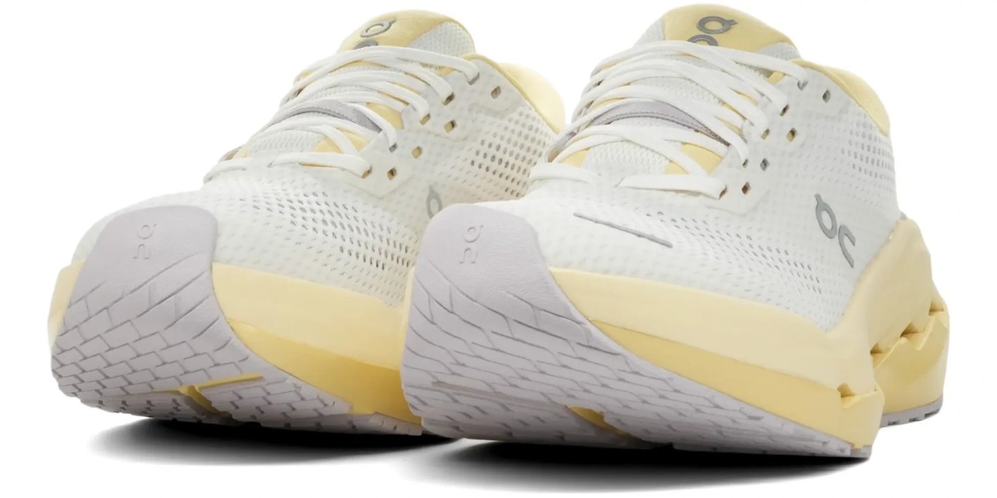 On Cloudrunner 3 Max running shoes in white and yellow, rear three-quarter view showing CloudTec outsole and heel detail