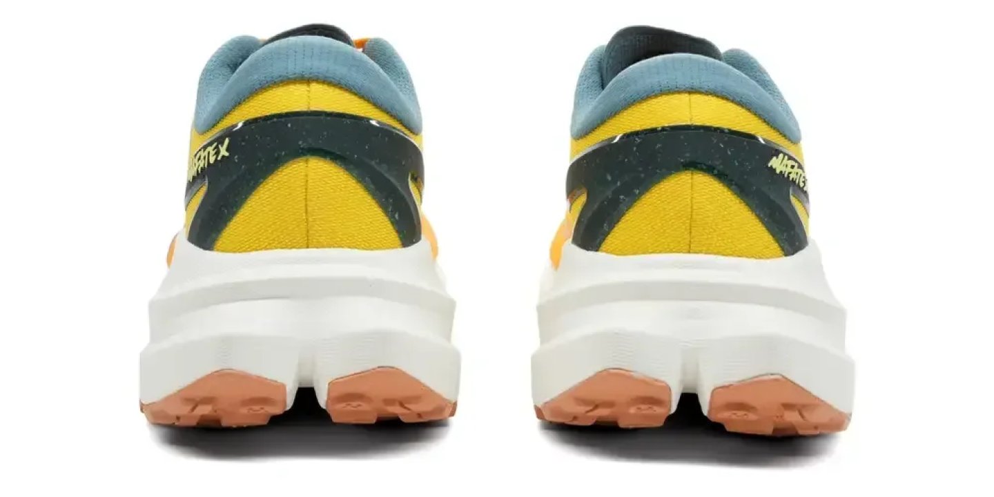 Rear view of Avafatex running shoes in yellow and teal with white midsole and gum rubber outsole.