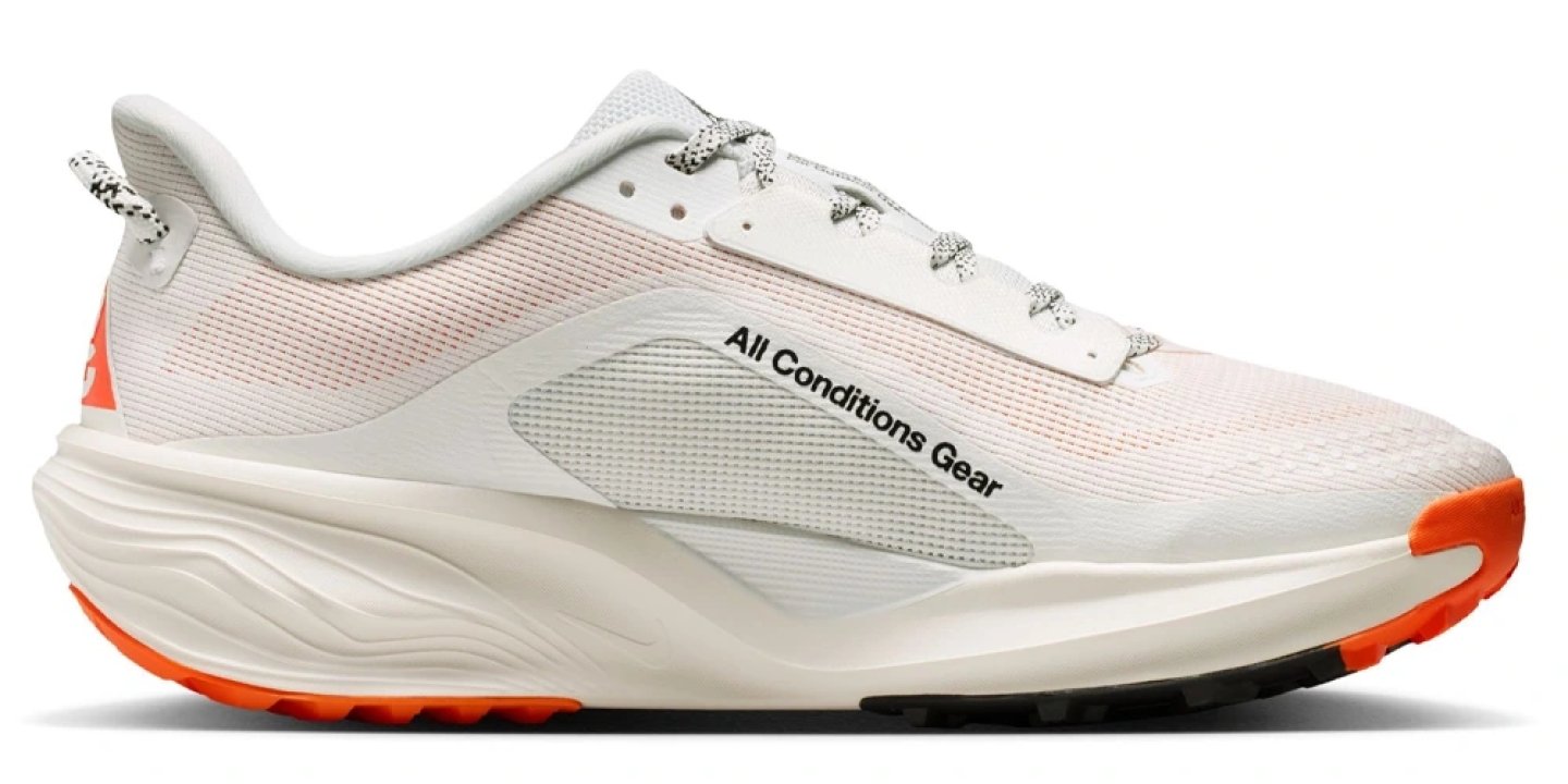 Nike ACG All Conditions Gear trail running shoe in white and orange with chunky midsole, lateral view