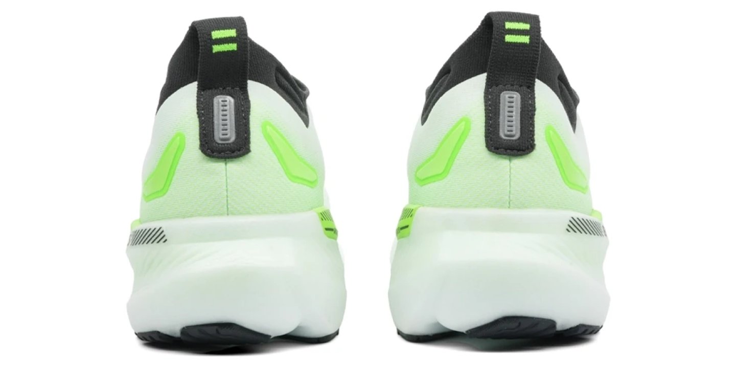 Rear view of a pair of Nike React Infinity Run shoes in Ghost Green with neon volt Swoosh details and white foam midsole