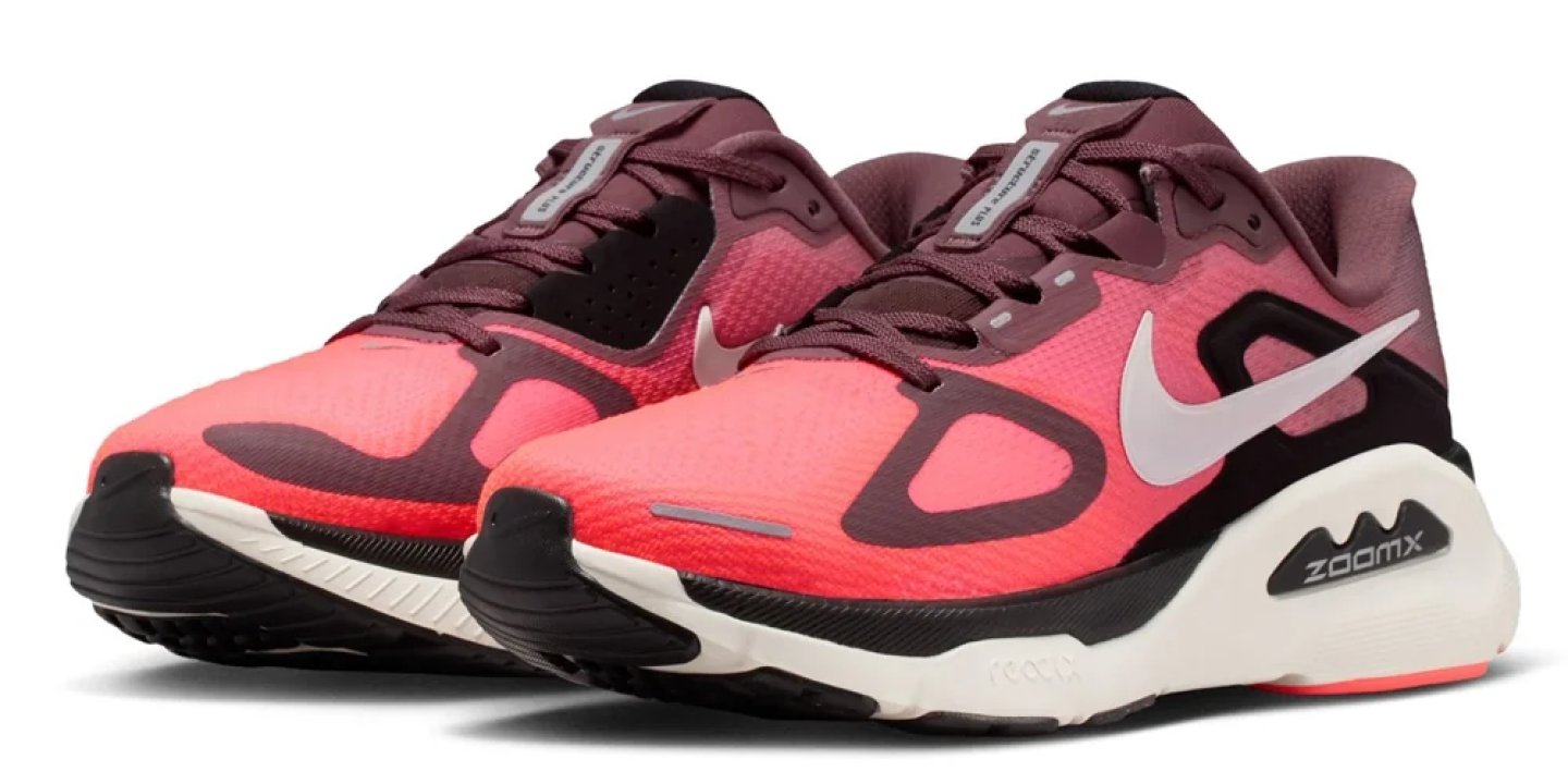 Nike ZoomX running shoes in coral and burgundy gradient with cream foam midsole and black outsole, pair view.