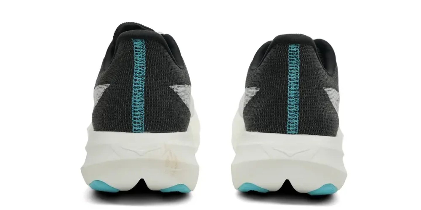 Rear view of a pair of Hoka running shoes in black knit with teal stitching and a thick white cushioned midsole